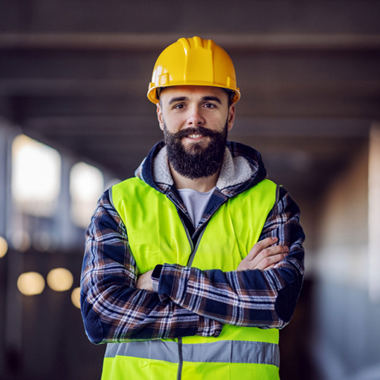 Hi-vis workwear modelled by a man to highlight embroidery and print options for the construction and trades industry in Haverhill.